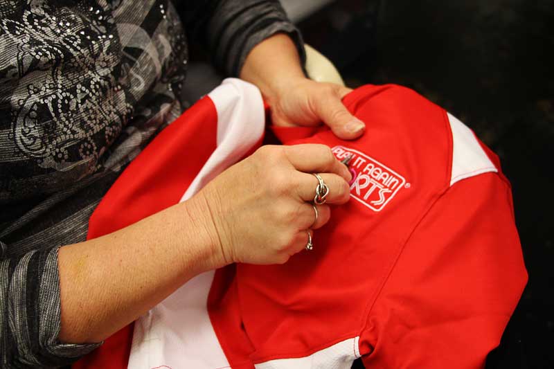 Trimming embroidered design after finished