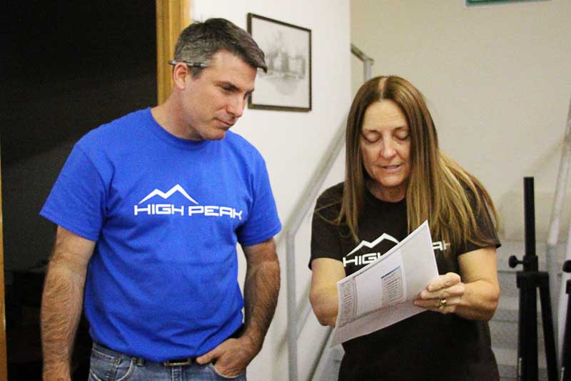 Employees discussing how to keep your cost low