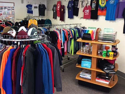 Inside of store featuring UVA cavilier clothing