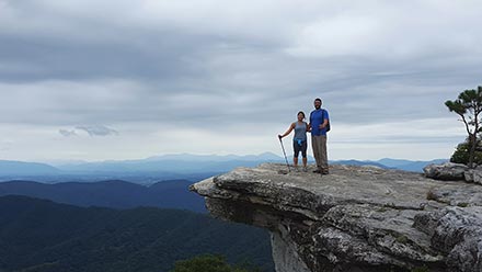 High Peak employee hiking to Mcafee's Knob